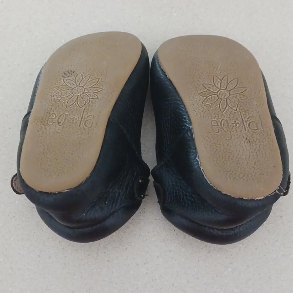 Teg+Lai  T Strap Black Rubber Flex Sole Shoes
